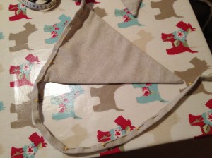 Pinned binding to triangles ready for handstitching